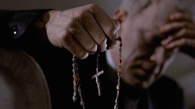 IMAGE: Still - Merrin and rosary