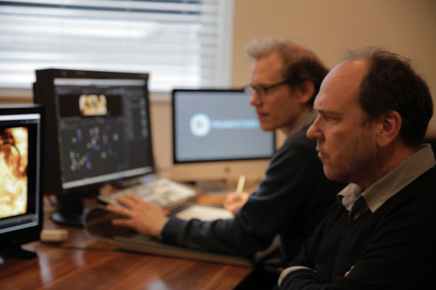IMAGE: Kleinman and Bartlett working at Framestore in front of computers